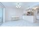 Dining room featuring tile floors and an open layout connecting to the kitchen at 1655 S Highland Ave # B118, Clearwater, FL 33756