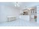 Bright dining area with tile floors and easy access to a slider and kitchen at 1655 S Highland Ave # B118, Clearwater, FL 33756