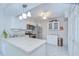 Well-lit kitchen featuring stainless steel appliances, white cabinets, and a ceiling fan at 1655 S Highland Ave # B118, Clearwater, FL 33756