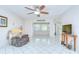 Cozy living room features tile floors, ceiling fan, and seamless transitions to other areas at 1655 S Highland Ave # B118, Clearwater, FL 33756