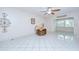 Open living area showcasing white tile flooring, ceiling fan, and neutral wall color at 1655 S Highland Ave # B118, Clearwater, FL 33756
