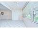 Bright sunroom with large windows and neutral colors, offering a relaxing space at 1655 S Highland Ave # B118, Clearwater, FL 33756
