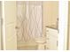 Well-lit bathroom featuring a shower with a patterned curtain and vanity with granite countertop at 16623 Carlton Pond St, Wimauma, FL 33598
