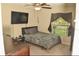 Well-lit bedroom featuring a bed, ceiling fan, and window at 16623 Carlton Pond St, Wimauma, FL 33598