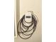 Installed Tesla charger and cable mounted on a white concrete exterior wall at 16623 Carlton Pond St, Wimauma, FL 33598