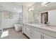 Bright bathroom featuring a glass shower, soaking tub, and dual vanity sinks at 199 Dali Blvd # 607, St Petersburg, FL 33701