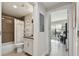 Well-lit bathroom with tile shower, modern fixtures, and view to connected living space at 199 Dali Blvd # 607, St Petersburg, FL 33701