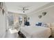 Sun-filled bedroom boasts hardwood floors, a cozy seating area, and a serene atmosphere at 199 Dali Blvd # 607, St Petersburg, FL 33701