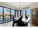 Dining area with a marble table, black chairs, and views from the large windows at 199 Dali Blvd # 607, St Petersburg, FL 33701
