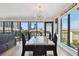 Bright dining room with a modern chandelier and large windows offering city views at 199 Dali Blvd # 607, St Petersburg, FL 33701
