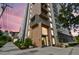 Modern condo building exterior with large windows and balconies, enhanced by lush landscaping and a welcoming entrance at 199 Dali Blvd # 607, St Petersburg, FL 33701