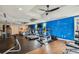 Community gym featuring treadmills, stationary bikes, and ample room for weight training with vibrant blue accent wall at 199 Dali Blvd # 607, St Petersburg, FL 33701