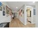Long hallway adorned with artwork, leading to a stylish bathroom with modern fixtures at 199 Dali Blvd # 607, St Petersburg, FL 33701