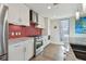 Updated kitchen showcasing stainless steel appliances, ample counter space, and modern tile backsplash at 199 Dali Blvd # 607, St Petersburg, FL 33701