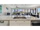 Gourmet kitchen featuring granite countertops, stainless steel appliances, and large windows with city views at 199 Dali Blvd # 607, St Petersburg, FL 33701