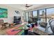 Living room with floor-to-ceiling windows, modern decor and city views, ideal for relaxation at 199 Dali Blvd # 607, St Petersburg, FL 33701