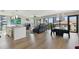 An open floor plan featuring the kitchen, dining, and living areas with city views at 199 Dali Blvd # 607, St Petersburg, FL 33701