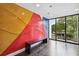 Lobby featuring a colorful accent wall, bench seating, and oversized windows at 199 Dali Blvd # 607, St Petersburg, FL 33701