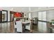 Common area with a kitchen and dining space that features modern light fixtures and stainless steel appliances at 199 Dali Blvd # 607, St Petersburg, FL 33701