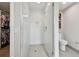 Bright shower featuring frameless glass doors, tile surround, and built-in niche at 199 Dali Blvd # 607, St Petersburg, FL 33701