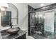 Modern bathroom featuring black marble walls and a sleek vessel sink at 2010 4Th W Ave, Palmetto, FL 34221