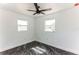 Bright bedroom with white walls, two windows, and marble floors at 2010 4Th W Ave, Palmetto, FL 34221