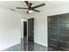 Stylish bedroom with a modern ceiling fan and elegant sliding closet doors at 2010 4Th W Ave, Palmetto, FL 34221