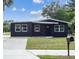Charming single-story home with a well-maintained lawn and freshly painted exterior at 2010 4Th W Ave, Palmetto, FL 34221