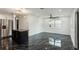 Open-concept living space with marble floors and modern lighting fixtures at 2010 4Th W Ave, Palmetto, FL 34221