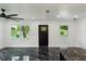 Modern living room with bright white walls and marble floors at 2010 4Th W Ave, Palmetto, FL 34221