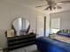 Comfortable main bedroom featuring a bed, dresser and ample natural light from windows at 205 Portia S St, Nokomis, FL 34275