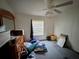 Simple bedroom with minimal decor, natural light, and plenty of space at 205 Portia S St, Nokomis, FL 34275