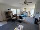 View of the living room highlighting the open floor plan and natural light from windows at 205 Portia S St, Nokomis, FL 34275