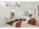 Inviting living room featuring a ceiling fan, ample light and neutral decor at 212 W Humphrey St, Tampa, FL 33604