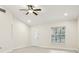 Bright and airy living room featuring a ceiling fan, ample light and neutral decor at 212 W Humphrey St, Tampa, FL 33604