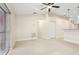 Bright living room features light wood floors, sliding glass doors and ceiling fan at 212 W Humphrey St, Tampa, FL 33604