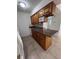 Kitchen features wooden cabinets, granite countertops, stainless steel sink and microwave at 226 Thorn Tree Pl # 226, Brandon, FL 33510