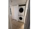 A compact laundry closet features a stacked Samsung washer and dryer unit at 226 Thorn Tree Pl # 226, Brandon, FL 33510
