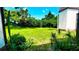 Expansive backyard featuring lush greenery and mature trees, creating a private oasis at 230 N Bayshore Blvd # 103, Clearwater, FL 33759