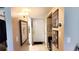 Inviting hallway with neutral tones, leading to a bright white front door at 230 N Bayshore Blvd # 103, Clearwater, FL 33759