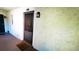 Welcome to condo 103, featuring an ornate door with security screen and a warm welcome mat at 230 N Bayshore Blvd # 103, Clearwater, FL 33759