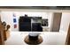 Kitchen featuring modern black appliances, and light colored cabinetry at 230 N Bayshore Blvd # 103, Clearwater, FL 33759