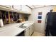 View of kitchen featuring white countertops and cabinetry with an undermount sink at 230 N Bayshore Blvd # 103, Clearwater, FL 33759