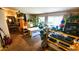 Cozy living room featuring natural light, shelving, and a variety of decor at 230 N Bayshore Blvd # 103, Clearwater, FL 33759