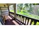 Outdoor patio features a bench and picturesque garden view at 230 N Bayshore Blvd # 103, Clearwater, FL 33759