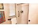 Simple shower with soap shelf, grab bar, and a bright window at 230 N Bayshore Blvd # 103, Clearwater, FL 33759