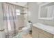 Bright bathroom with updated tiled shower, modern vanity, and new fixtures at 2419 Wishing Well Way, Tampa, FL 33619