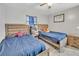 Comfortable bedroom with two beds and a natural light at 2419 Wishing Well Way, Tampa, FL 33619