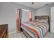 Serene bedroom featuring a comfortable bed, and a dresser at 2419 Wishing Well Way, Tampa, FL 33619