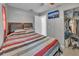 Well-lit bedroom featuring a bed, a closet, and mounted TV at 2419 Wishing Well Way, Tampa, FL 33619